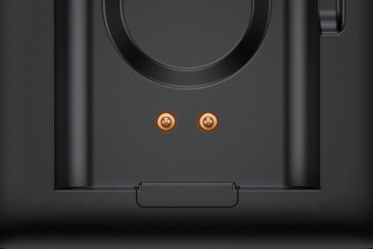 Hume Band charger close up of the two charging pins in the open dock SwanScout 513