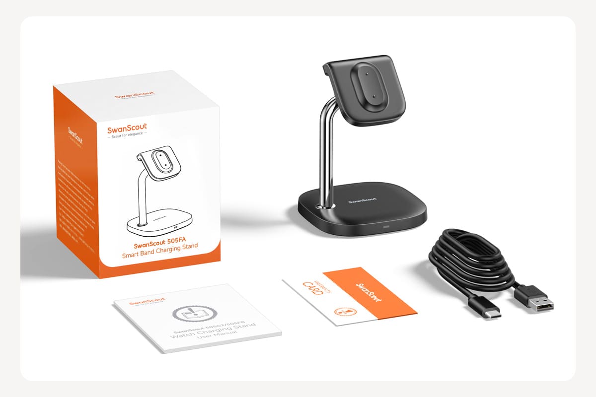 Package contents including wireless charging station USB-A to USB-C cable and manual for Fitbit with SwanScout 505FA