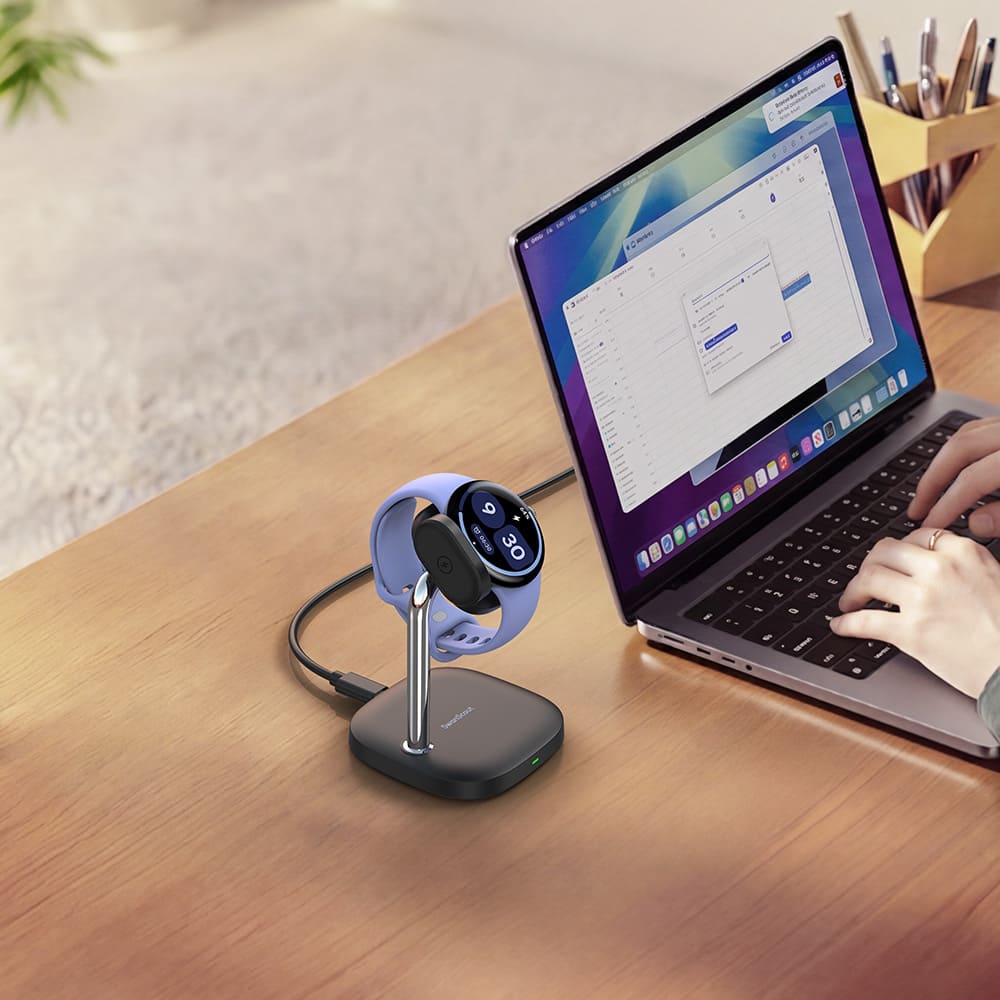 Pixel Watch 4 charging stand on office desk next to computer offering convenient desktop charging for work and productivity SwanScout 505G4
