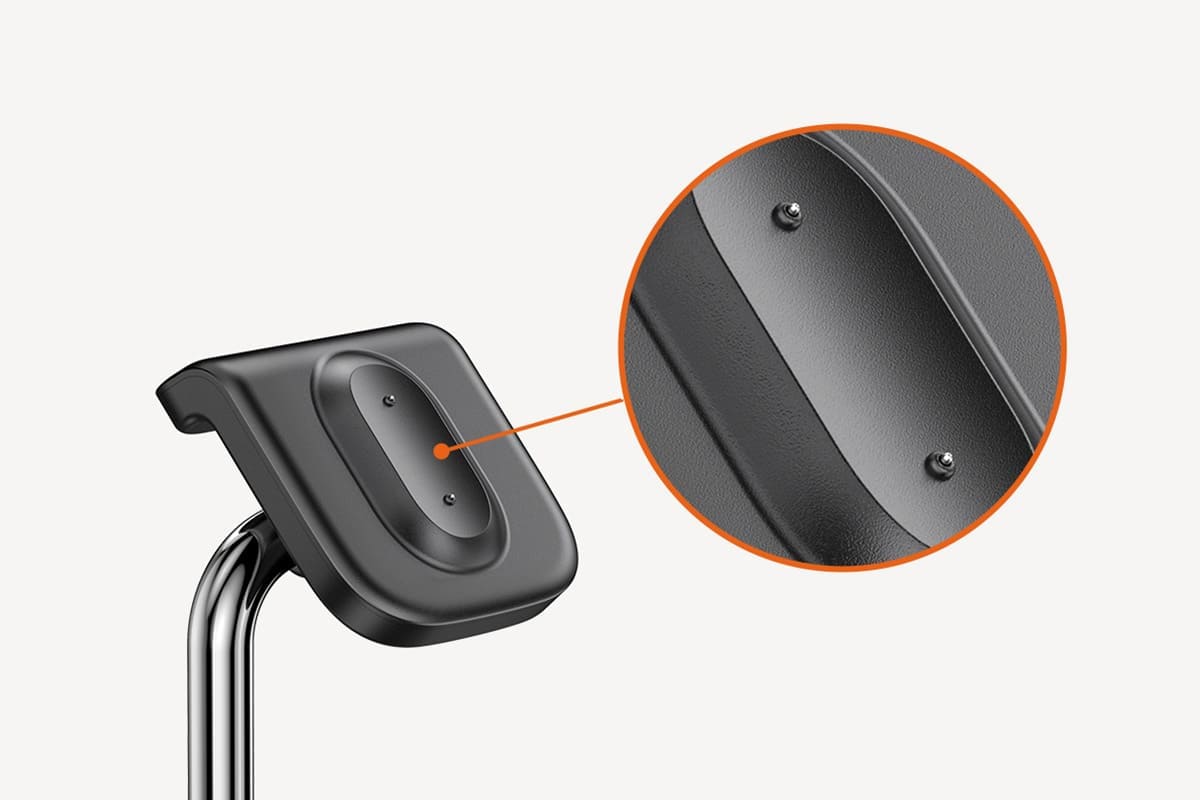 Detailed close-up of durable palladium charging contacts on fitbit wireless charging station with SwanScout S10034FA